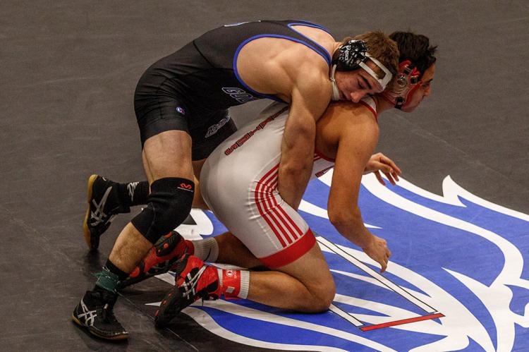 Goddard senior Troy Fisher used two pins and an 11-3 major decision to earn another regional championship. (Photo by Wendy Morrow)