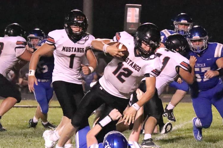 Sylvan-Lucas has nearly 40 players out for 8-Man football after gaining a number of students following the Wilson school closure and the Mustangs looks like an 8-Man II contender after a hard-fought win over a much-improved Lincoln team Friday night. (Photo: Lori Spear)