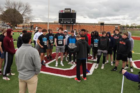 Athletes receive instruction on how to complete the standing broad jump test at last Saturday's Sharp Performance Combine. (Photo by Rayne Schmidtberger)